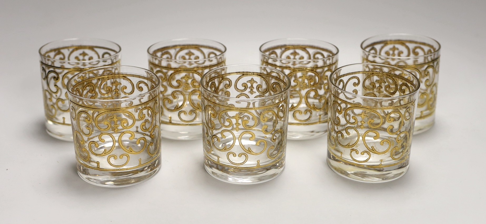 A set of seven Georges Briard gilded glass tumblers,