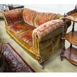 A late Victorian drop arm Chesterfield settee with carpet upholstery, length 175cm, width 78cm,