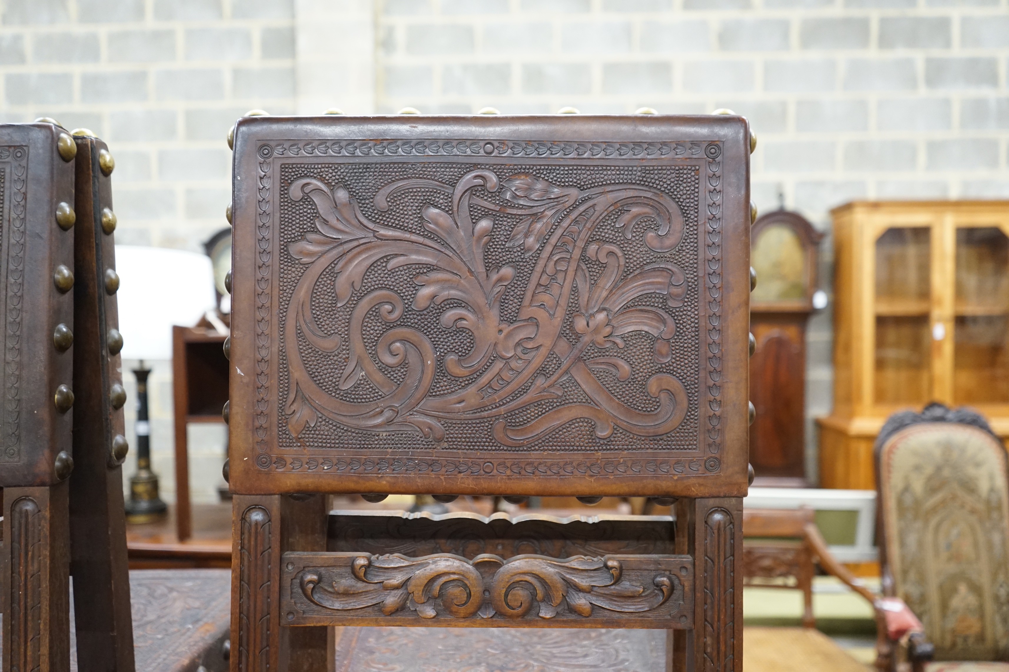 A set of six 18th century style brass studded carved oak and embossed leather dining chairs - Image 2 of 4