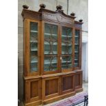 A William Yeoward Cherington chestnut breakfront bookcase, width 220cm, depth 49cm, height 295cm