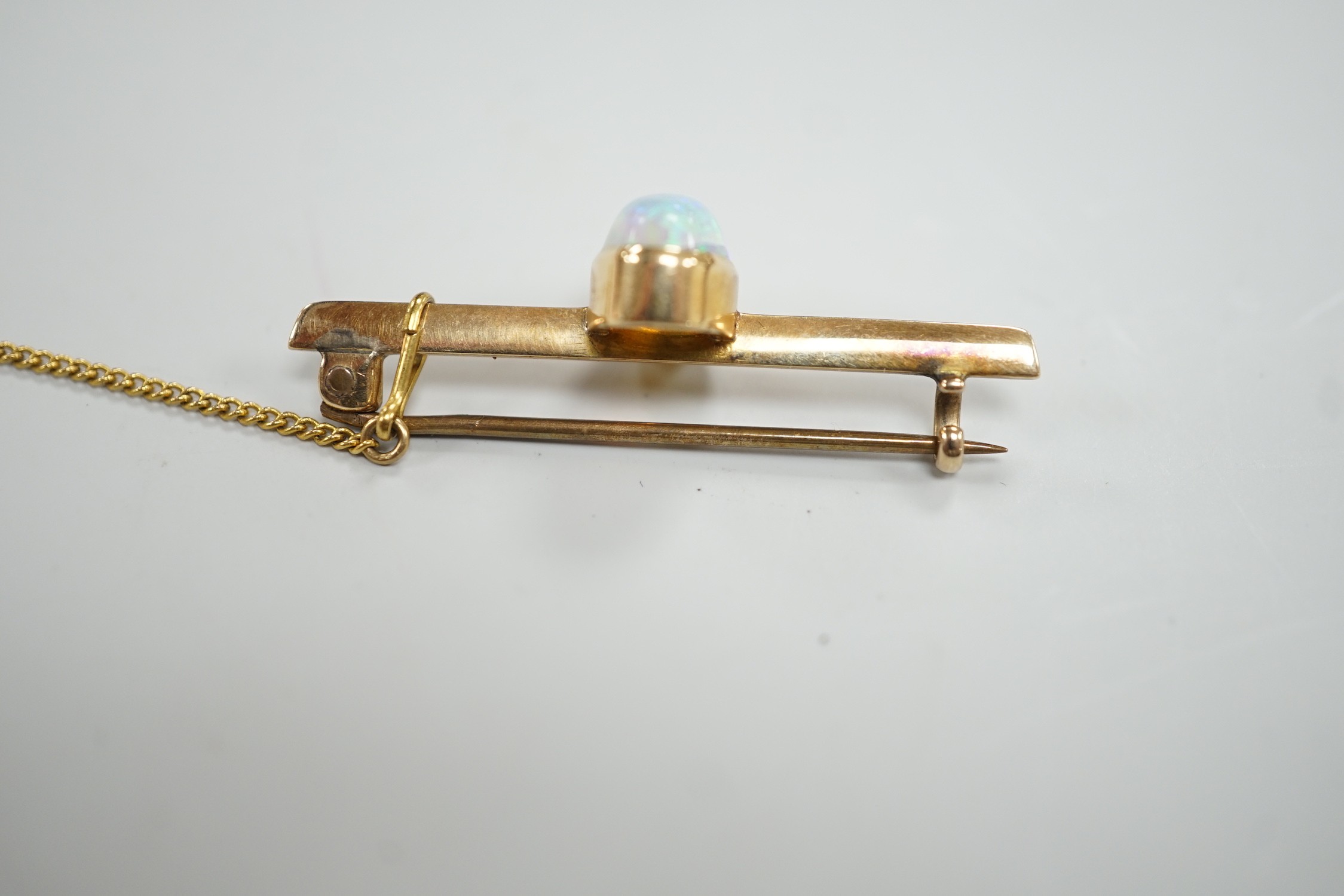 A yellow metal and single stone oval white opal set bar brooch, 39mm, gross weight 4.3 grams. - Image 4 of 4