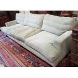 A large Howard style three seater settee upholstered in pale green fabric, length 300cm, depth