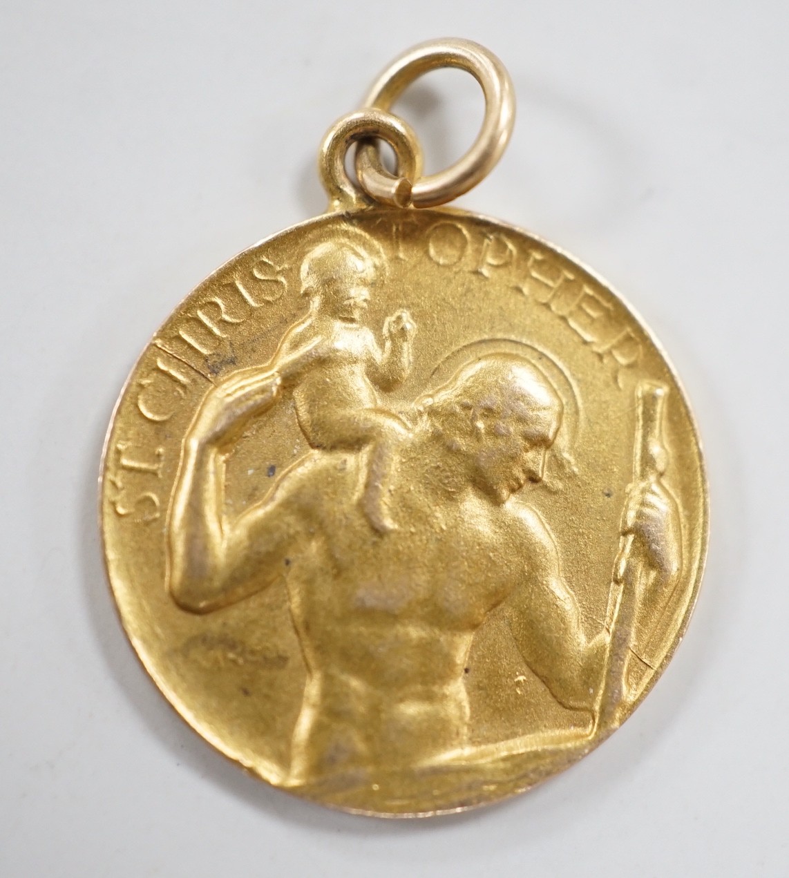 A 1960's 9ct gold St Christopher pendant, by P. Vincze, 17mm, 2.3 grams, stamped verso.