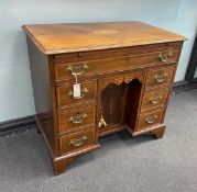 A George III later marquetry inlaid mahogany kneehole desk fitted slide, width 87cm, depth 50cm,