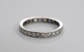 A white metal and diamond set full eternity ring, size N, gross weight 3 grams.