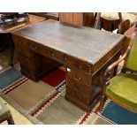 An early 20th century Chippendale revival mahogany pedestal desk, requiring restoration, length