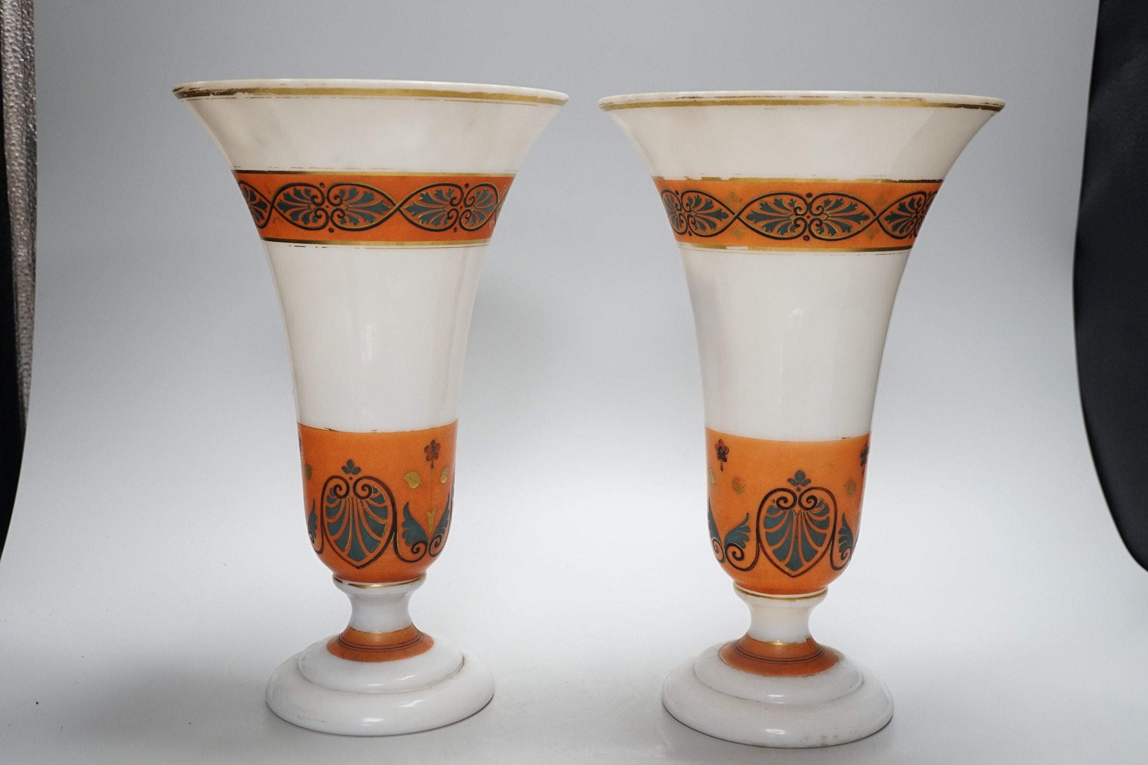 A pair of opaque glass anthemion vases, with orange decorative bands, 30cms high - Image 2 of 3