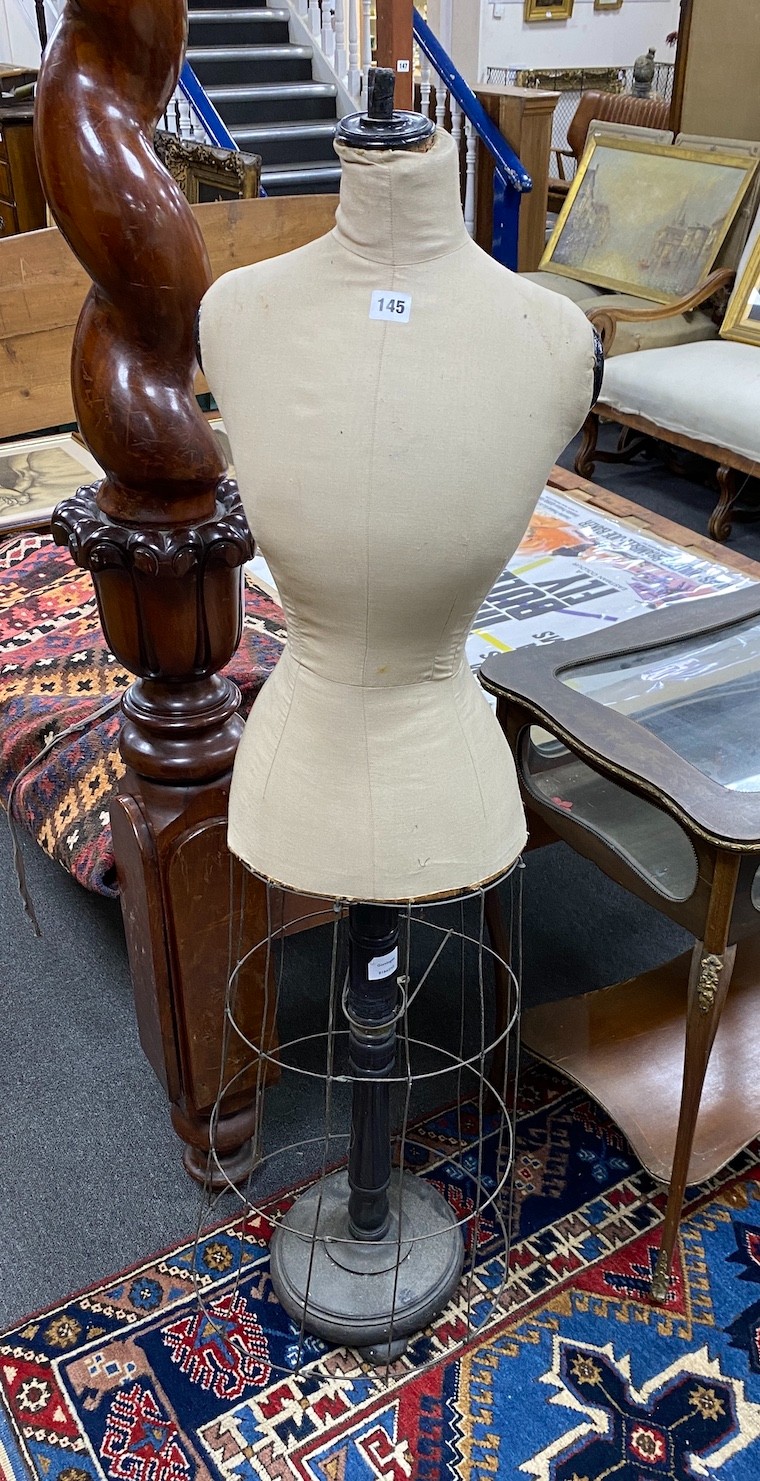 An early 20th century tailor's dummy, likely French, on telescopic stand