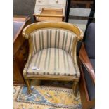 A Regency painted, parcel gilt upholstered side chair with scroll back and acanthus mounts over