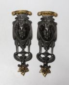 A pair of 19th century French parcel gilt furniture mounts, 18cm