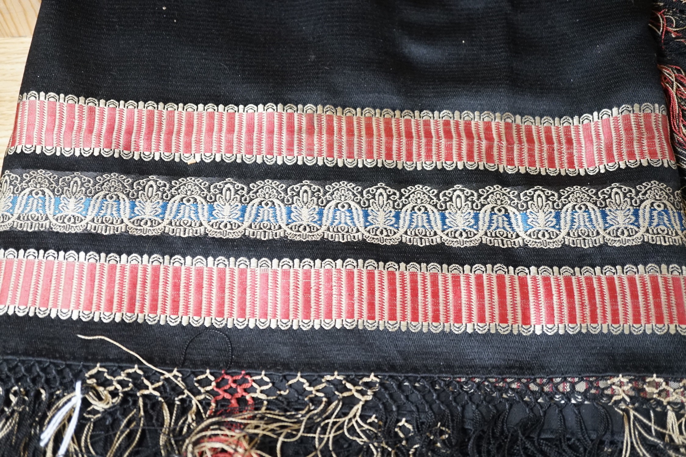 A Victorian black silk shawl woven, woven with multi-coloured Paisley designed stripes bordered with - Image 3 of 4