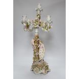 A Sitzendorf-style floral encrusted 4 branch candelabra, 57cms high