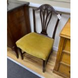 A pair of George III Hepplewhite style mahogany dining chairs, with stuff-over seats, on square