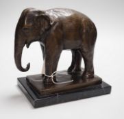 A bronze elephant, on black marble plinth, unsigned, 20cms high