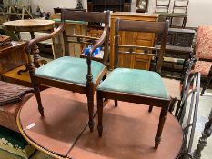 A set of four Regency mahogany dining chairs, one with arms