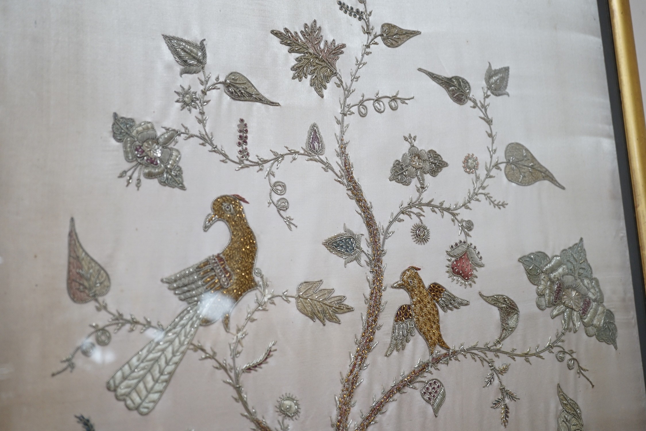 A framed silk, multi coloured metal thread embroidered Indian panel: a peacock seated amongst birds, - Image 3 of 8