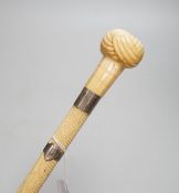 A 19th century scrimshaw whalebone walking cane with white metal mounts, 69cm