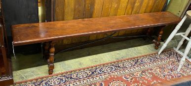 An 18th century style Italian design hardwood bench with wrought iron stretcher, length 213cm, depth