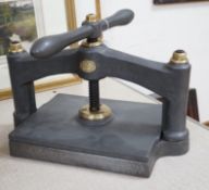 A Victorian Hooper & Son brass mounted cast iron book press, 43cm wide