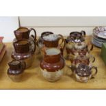 Eight various Royal Doulton Lambeth and other stoneware jugs and tea pots, one silver-mounted
