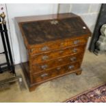 An 18th century walnut veneered bureau, adapted, fitted four graduating long drawers, width 97cm,