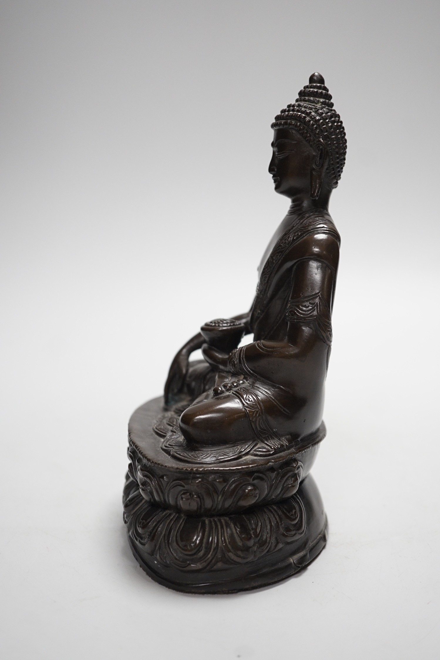 A Chinese bronze Buddha, on lotus base, 20cms high - Image 3 of 5