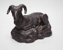 A patinated bronze of a recumbent ram, 22cm long