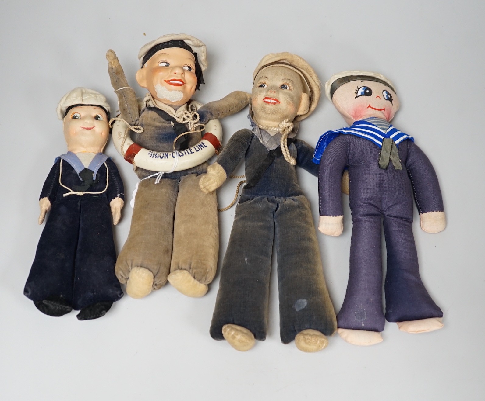 A Nora Wellling ‘sailor doll’ Union-Castle Line, two others and a later cloth sailor doll, (4)