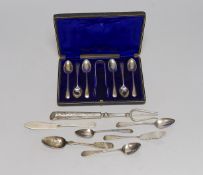 A cased set of six George V silver teaspoons, with sugar tongs and seven other items of silver or