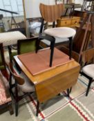 A 1950's G-plan table, approx. 150cm extended, width 82cm, height 72cm and four chairs