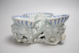 An early Bow porcelain three shell salt, the naturalistically modelled shells picked out in