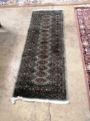 A Bokhara style green ground runner, 180 x 68cm