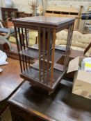 An Edwardian inlaid mahogany revolving bookcase, width 46cm, height 83cm