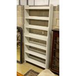 A modern painted open bookcase, width 100cm, depth 28cm, height 224cm