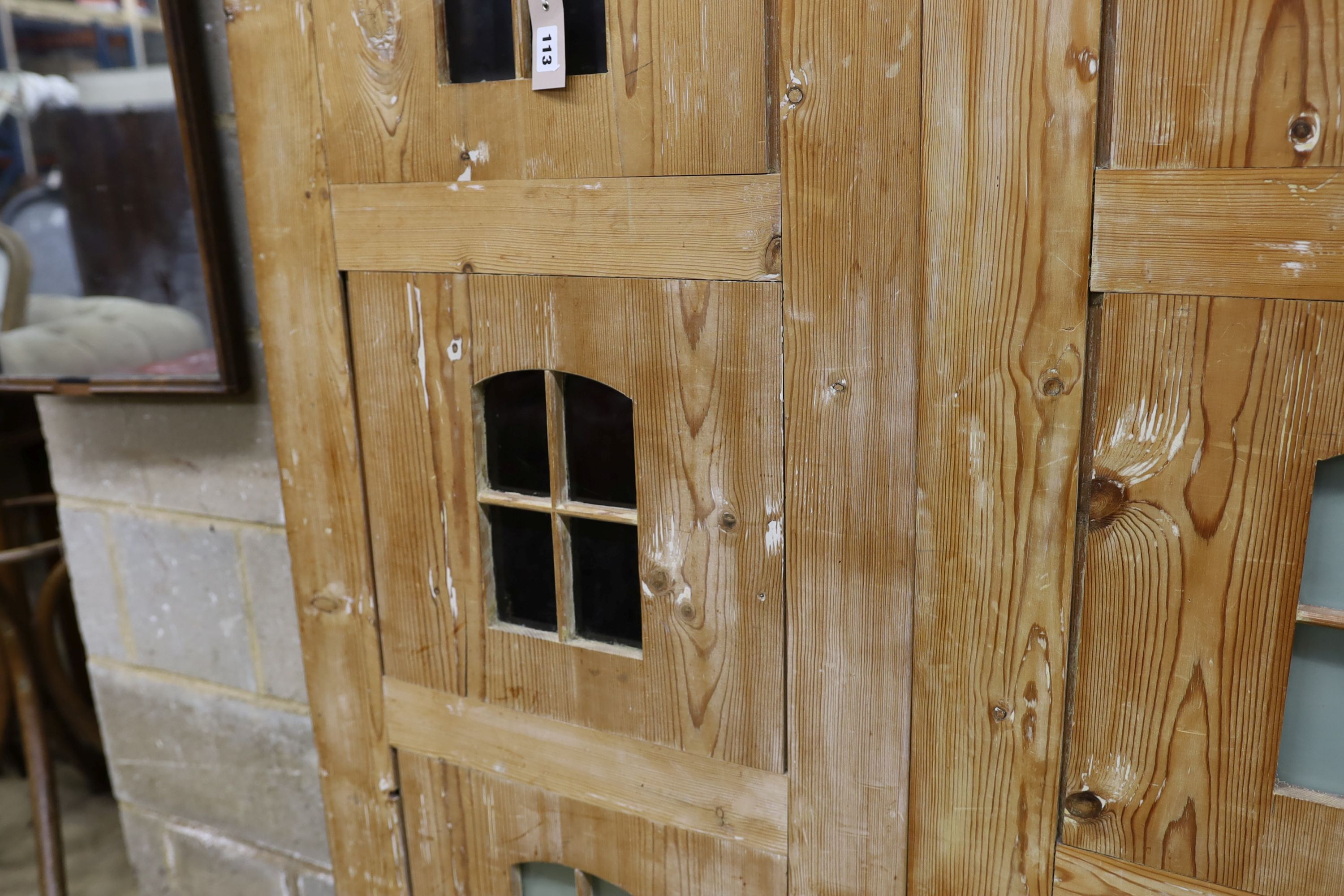 A 19th century stripped pine hall cupboard modelled as a dolls house the two door nine window facade - Image 3 of 20
