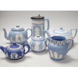 A group of Wedgwood and Wedgwood-style jasperware teapots and jugs.