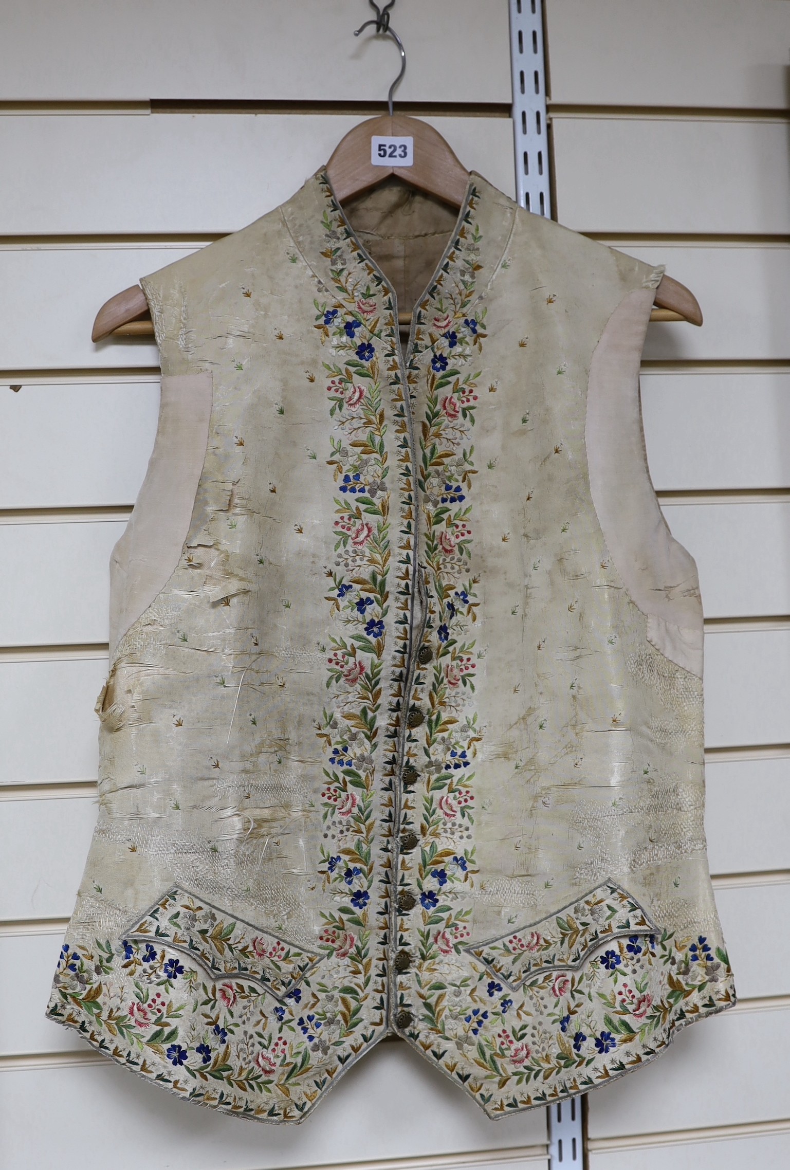 A late 18th early 19th century gentleman’s cream silk waistcoat Embroidered with polychrome silks in