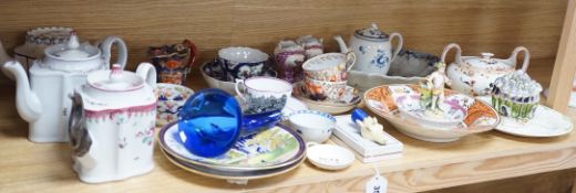 A collection of late 18th/19th century English ceramic teapots, cabinet cups, a jug, dishes and