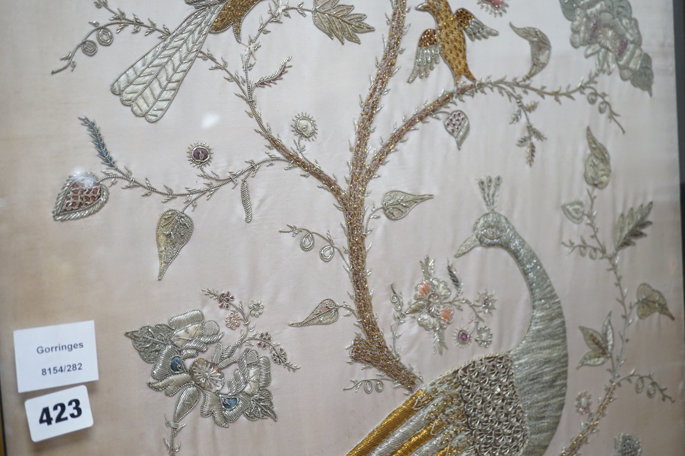 A framed silk, multi coloured metal thread embroidered Indian panel: a peacock seated amongst birds, - Image 4 of 8