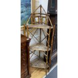 A Victorian bamboo mirrored three tier corner whatnot, width 61cm, depth 34cm, height 160cm