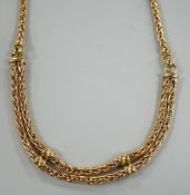 A modern continental yellow metal, single and twin strand interwoven link necklace, approximately