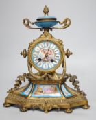 A 19th century French gilt-brass mantel clock with Sevres-style panels, 33cm