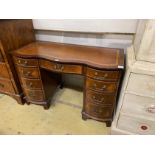 A reproduction mahogany leather topped kneehole writing table, width 114cm, depth 53cm, height 75cm