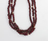 A Tiffany & Co triple strand garnet bead necklace, with 750 clasp and spherical spacers, 48cm