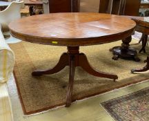 A Regency circular rosewood banded mahogany breakfast table, diameter 130cm, height 70cm