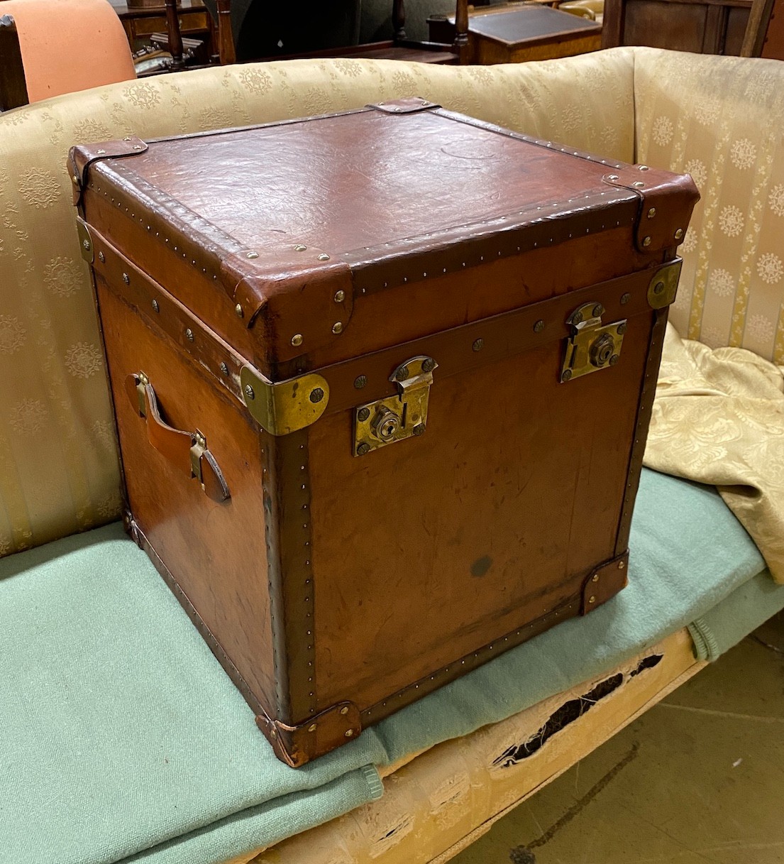 A Victorian style brass mounted tan leather trunk, length 47cm, depth 46cm, height 50cm