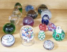A collection of mixed paperweights to include a faceted floral Perthshire example, other Scottish