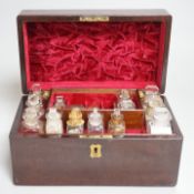 A 19th century mahogany cased travelling apothecary set with glass flasks, handle plate engraved ‘