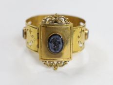 A Victorian gilt metal and four stone glass intaglio set bracelet, (repair), each stone carved