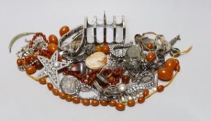 Mixed costume jewellery including a silver, marcasite and moonstone set flower brooch, faux amber